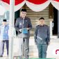 Bupati Pamekasan, KH. Kholilurrahman, bertindak sebagai inspektur upacara.